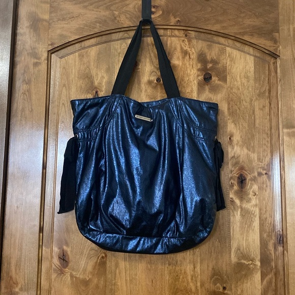 Juice couture tote. Navy blue with black straps. 1 zip pocket inside & 2 pockets - Picture 1 of 2